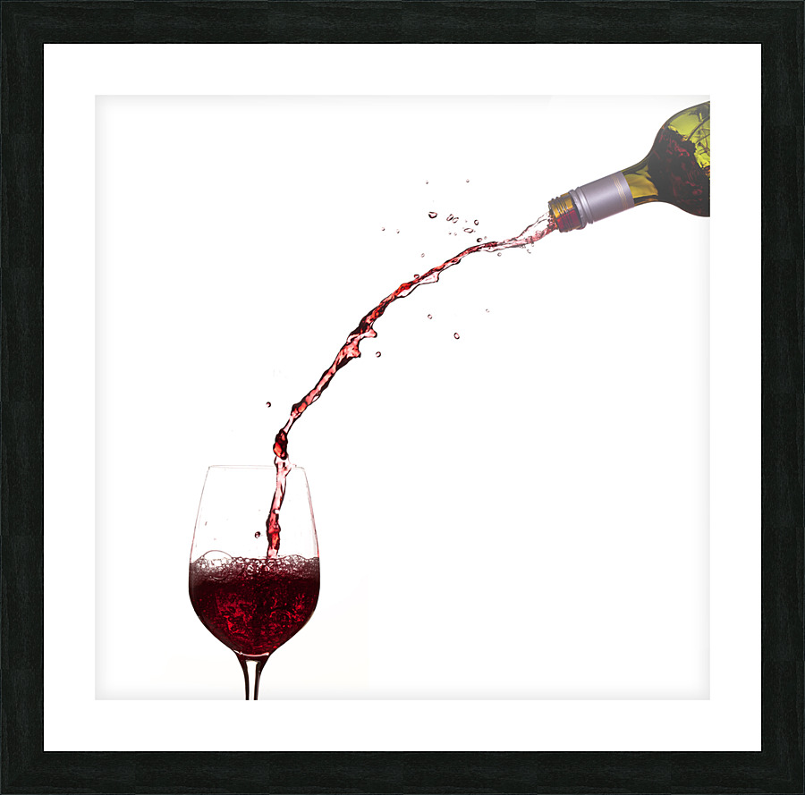 Wine pouring from bottle into glass Picture Frame print