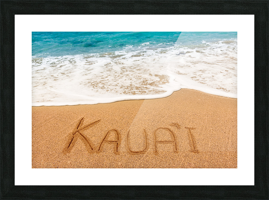 Kauai written in sandy beach Picture Frame print
