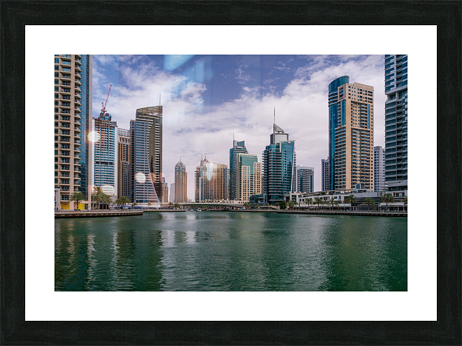 Modern buildings crowd the waterfront at Dubai Marina UAE Picture Frame print