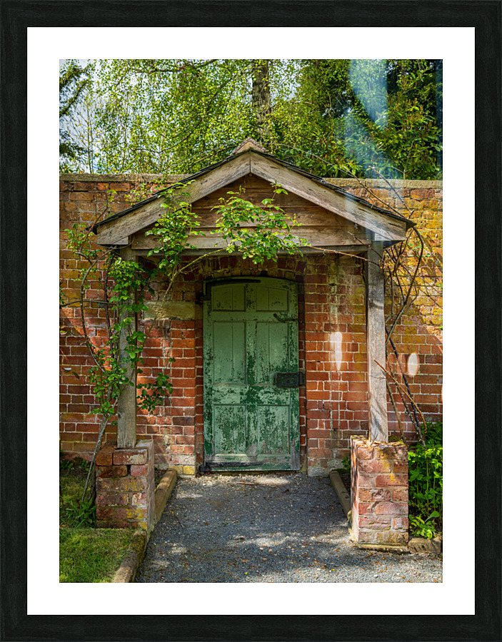 Painted green door and porch in walled garden wall Picture Frame print