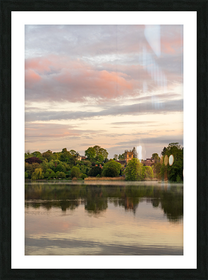 Sunset view across Ellesmere Mere in Shropshire to church Picture Frame print