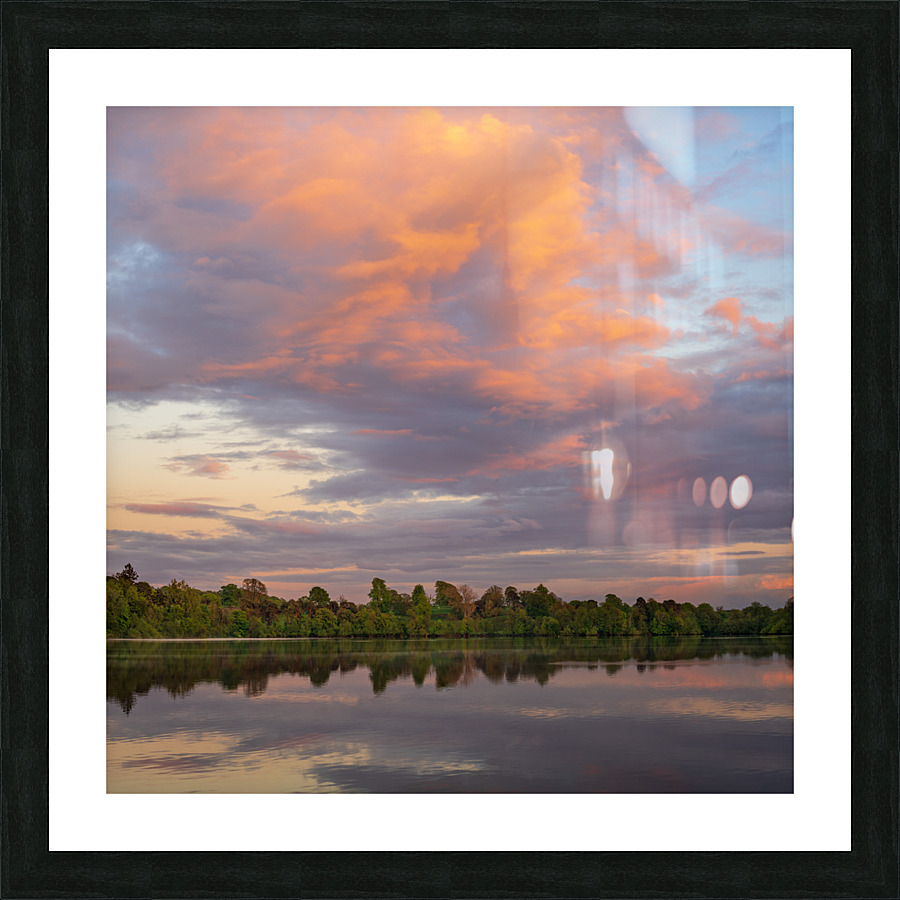 View across the Ellesmere Mere to a clear reflection of distant  Picture Frame print