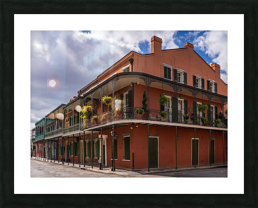 Traditional wrought iron balcony on ochre New Orleans house Picture Frame print
