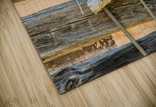 Old rake and mop against log cabin Steve Heap puzzle