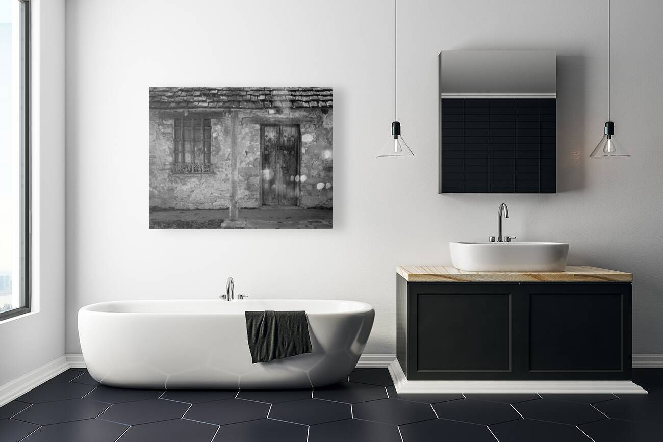 Rustic San Juan Mission building with an aged stone facade. Reproduction