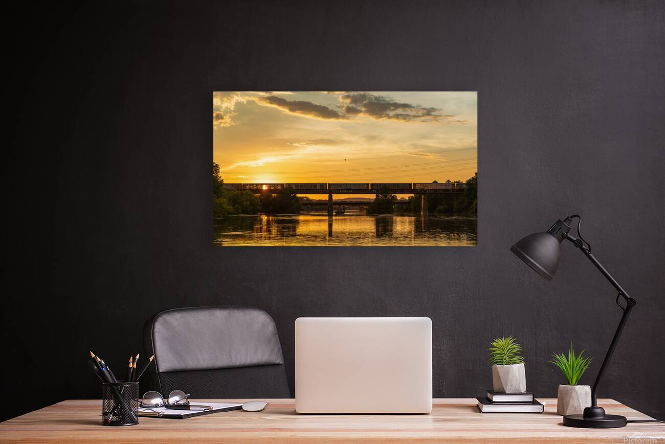 Freight train on the railroad bridge in Austin at sunset Reproduction