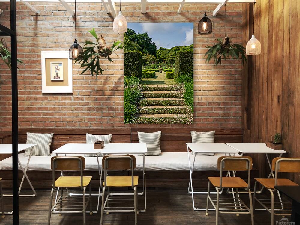 Stone steps into a hedged flower garden on the Isle of Wight Reproduction