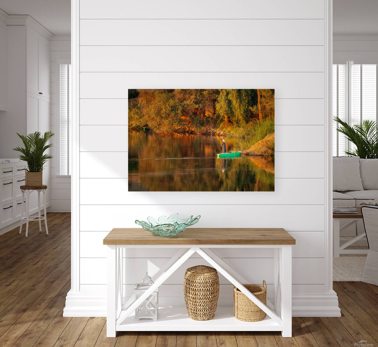 Man in traditional galabia fishing from small boat on river Nile Reproduction