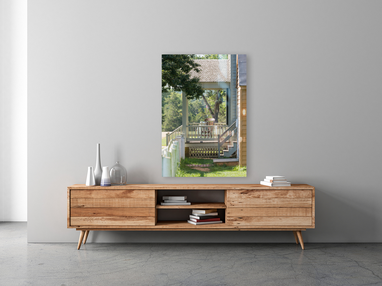 Wooden rocking chair on porch of old house Reproduction