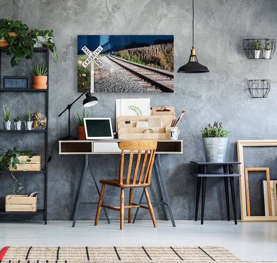 Oncoming train with railroad crossing sign Reproduction