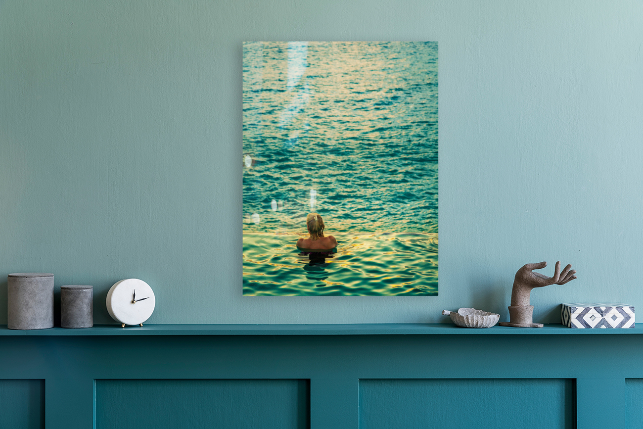 Womans head against infinity edge pool Reproduction