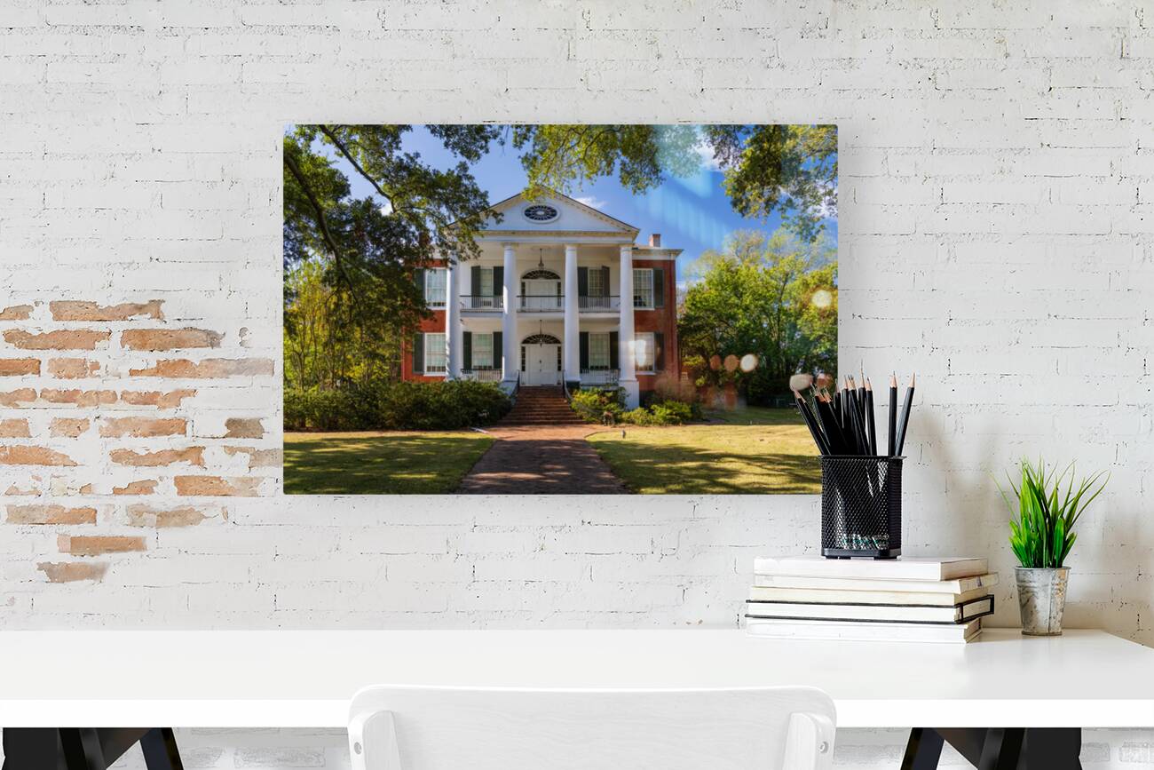 Facade of antebellum home in Natchez in Mississippi Reproduction