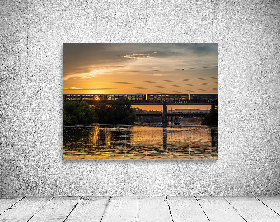 Freight train on the railroad bridge in Austin at sunset Wall Preview