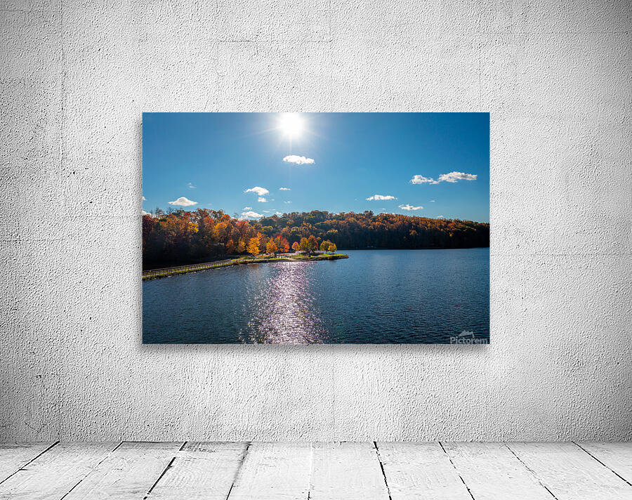 Sunburst above fall trees around the water at Cheat Lake Park Wall Preview