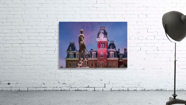 Mountaineer statue against Woodburn Hall tower Wall Preview