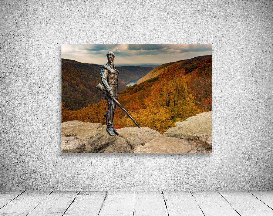 Mountaineer statue from WVU with fall leaves in West Virginia Wall Preview