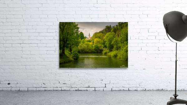 Church in the woods above peaceful river Wall Preview