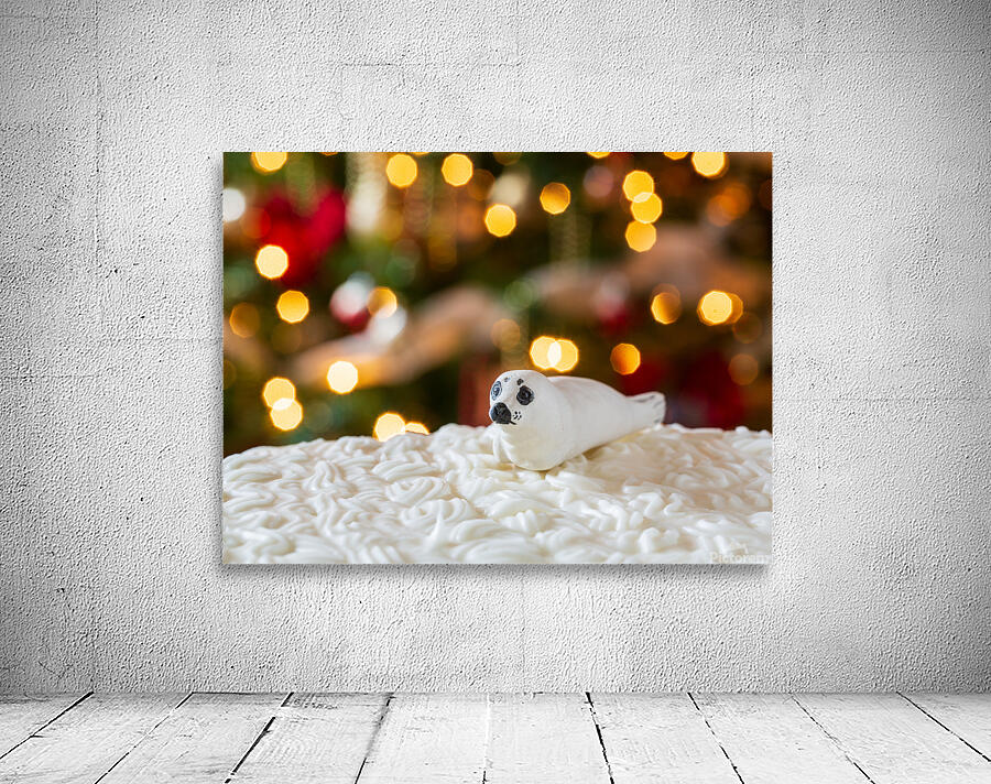 Seal on Christmas cake with tree lights Wall Preview