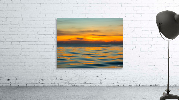 Infinity edge pool with sea underneath sunset Wall Preview