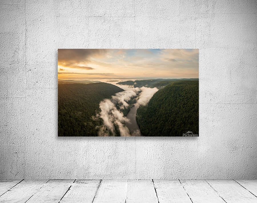 Mist swirling over Cheat River gorge at sunrise near Morgantown  Wall Preview