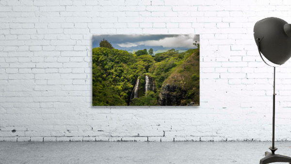 Opaekaa Falls sunlit as dark storm clouds gather over the hills Wall Preview