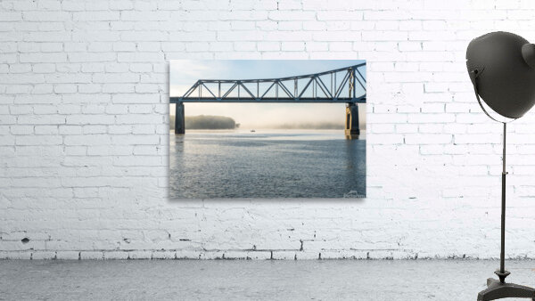 Fisherman fishing in Mississippi river on misty autumn morning Wall Preview