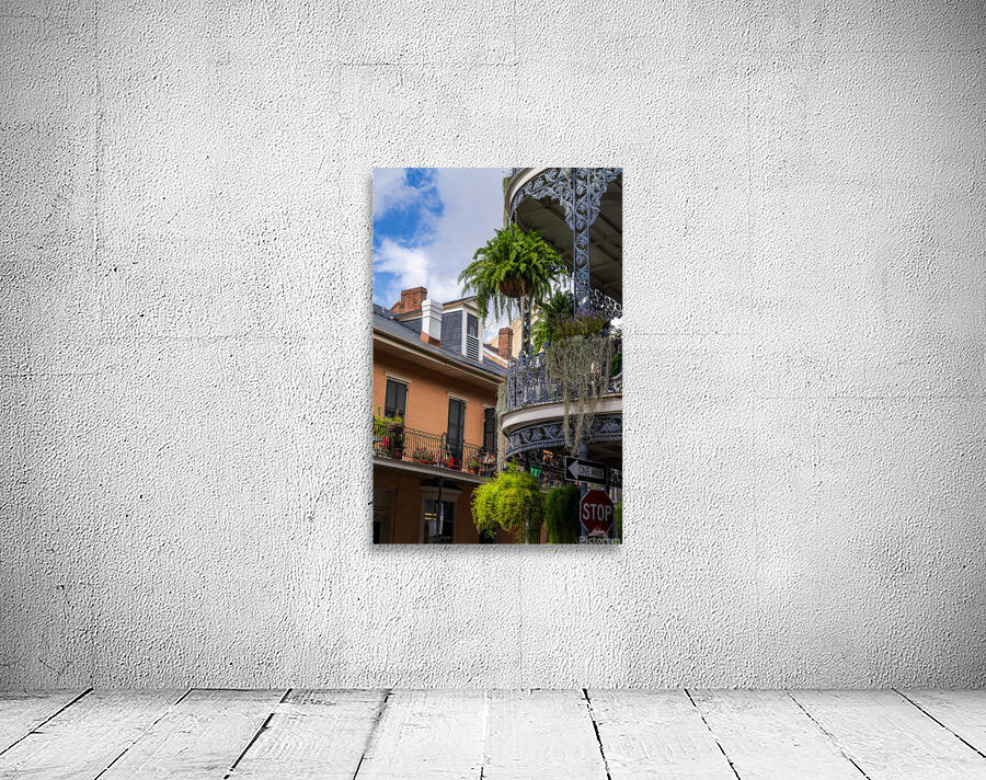 Traditional wrought iron balcony on brick New Orleans house Wall Preview