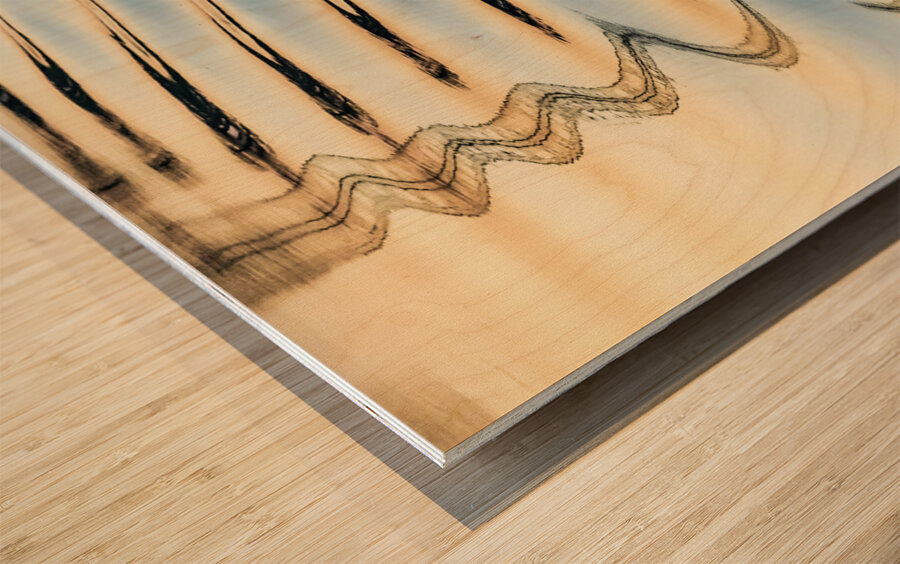 Reflections of electricity pylon at sunset in gentle river rippl Wood print