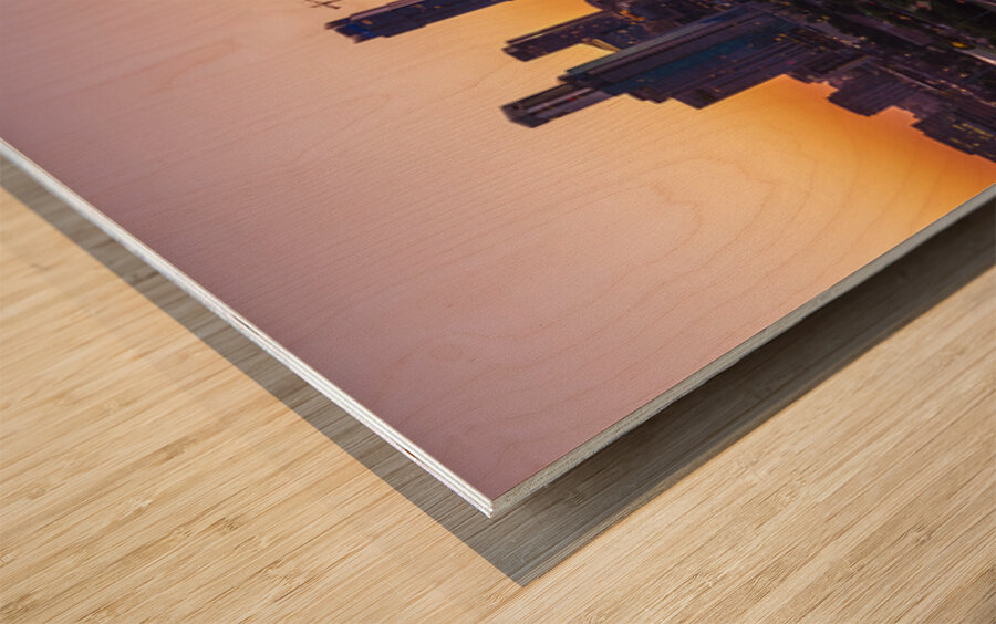 Orange skies behind skyline of Austin Texas as sun starts to ris Wood print