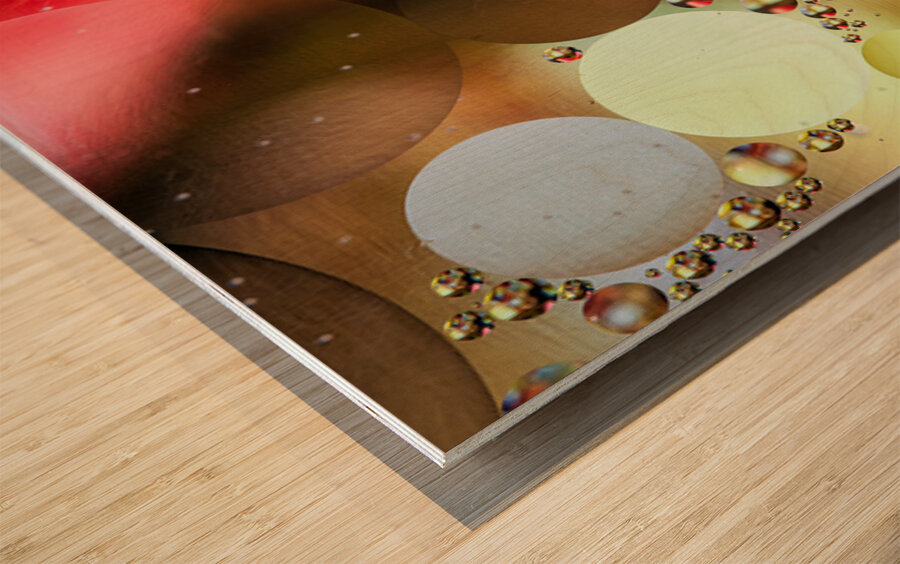 Oil and water reflecting dramatic colors Wood print