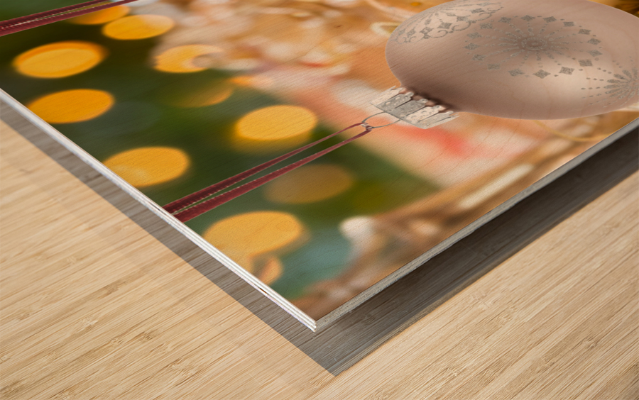 Three Christmas decorations on strings Wood print