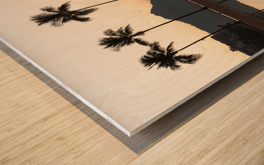 Sunrise over ocean with palm trees Wood print