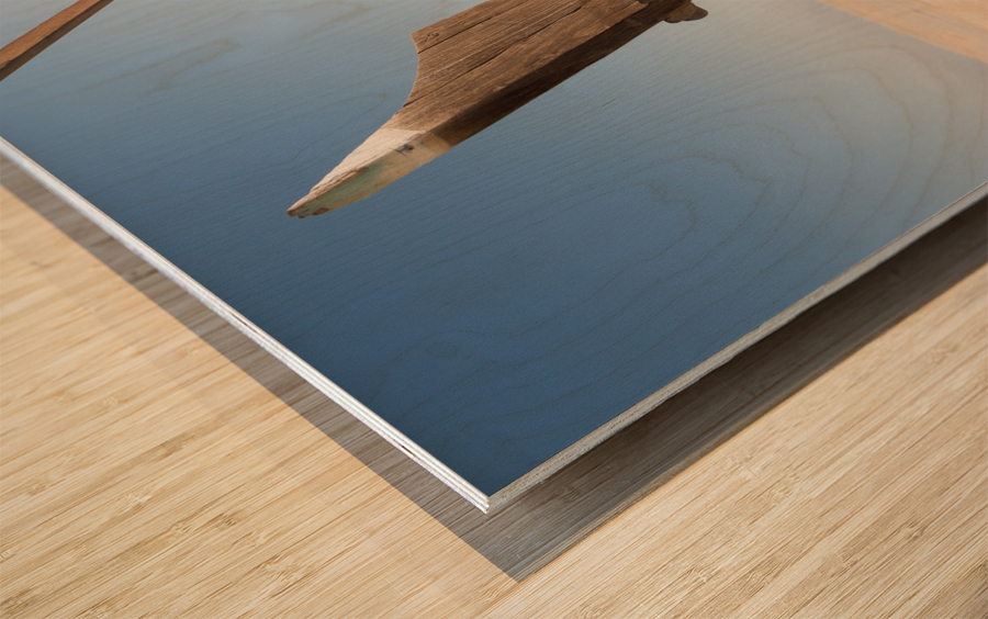 Fishermans boat or dhow on sand Wood print