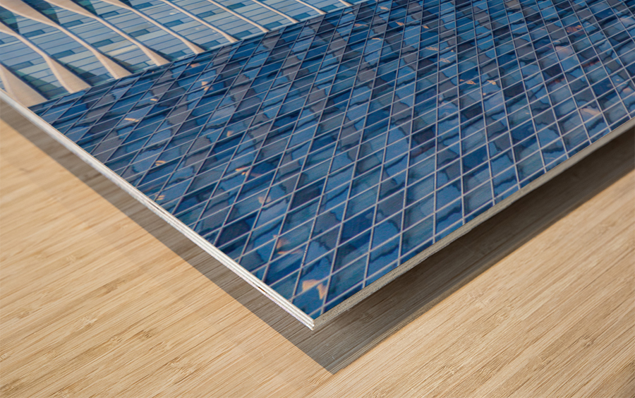 Distinctive hotel between skyscrapers Wood print