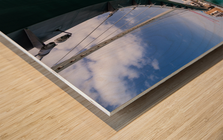 Modern apartments alongside Dubai Canal under Tolerance bridge Wood print