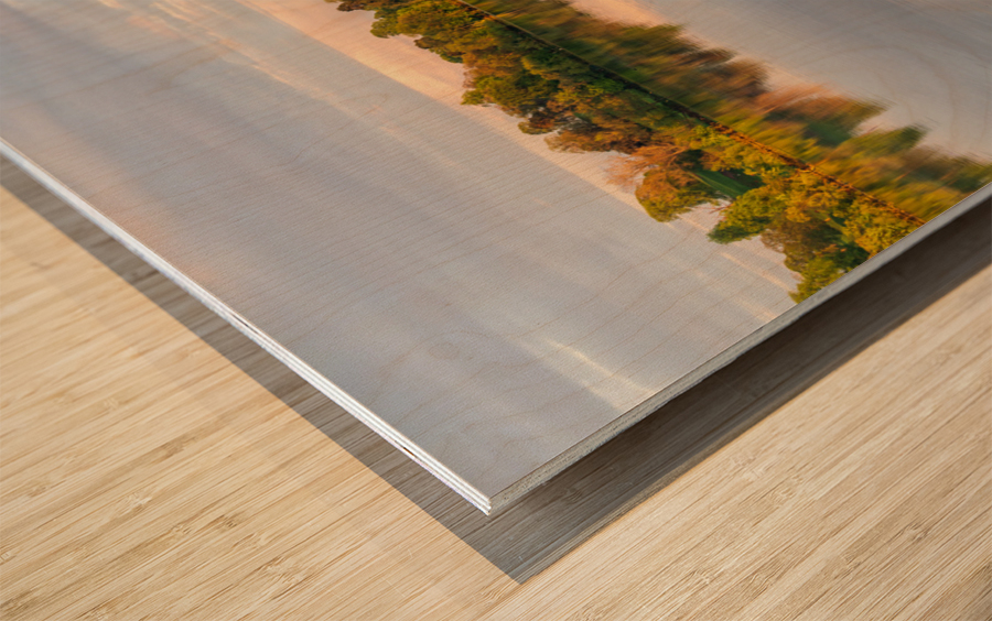 View across the Ellesmere Mere to a clear reflection of distant  Wood print