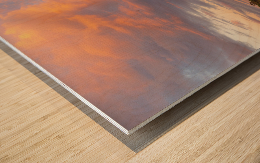 View across the Ellesmere Mere to a clear reflection of distant  Wood print