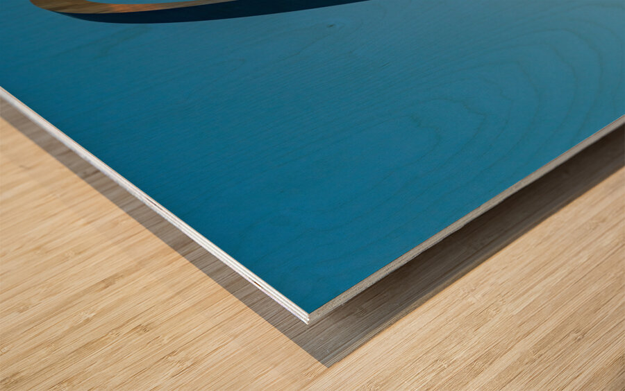 Unusual view of Gateway Arch at sunrise against blue sky Wood print