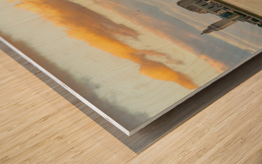 Skyline of Baton Rouge at sunset over river barges Wood print