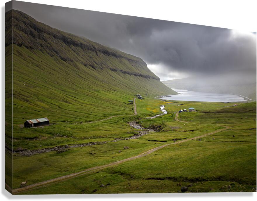 valley with cloudy sky on faroe islands Canvas Print