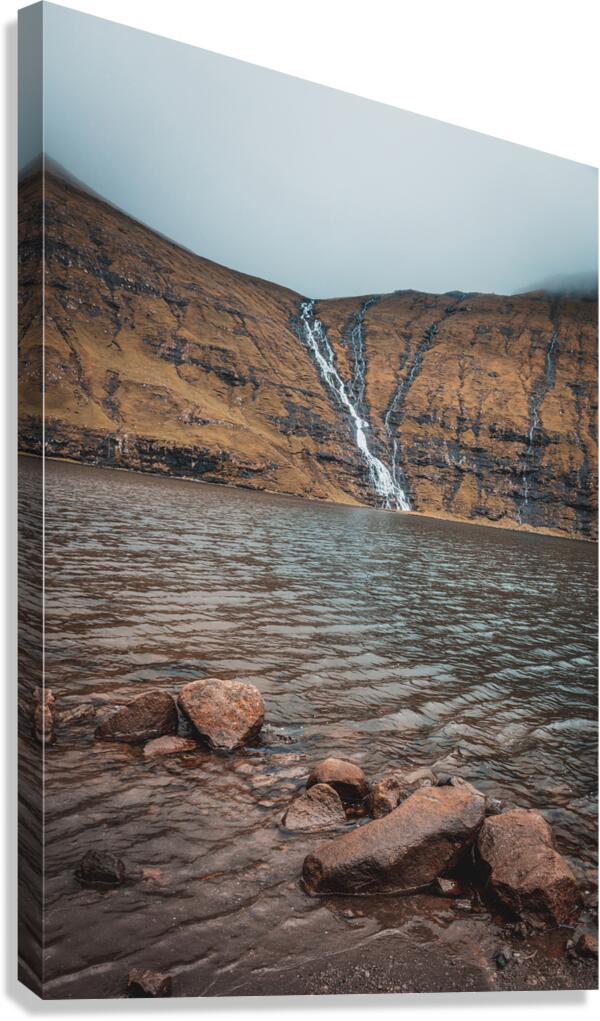 waterfalls that flow into the lake of Saksun in the Faroe Canvas Print
