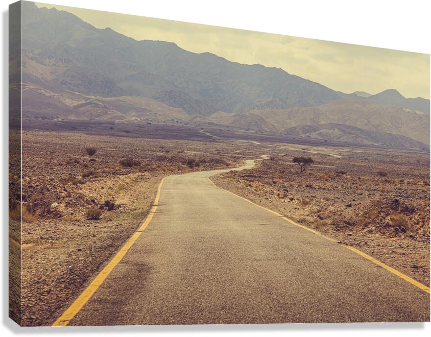desert road leading to wadi rum Jordan. Canvas Print