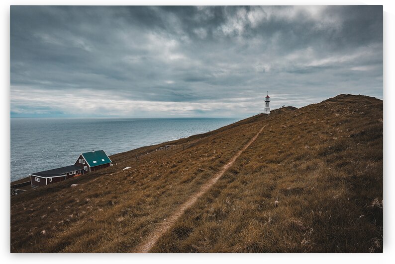 lighthouse on the island of Mykines Faroe. by Gualtiero Boffi