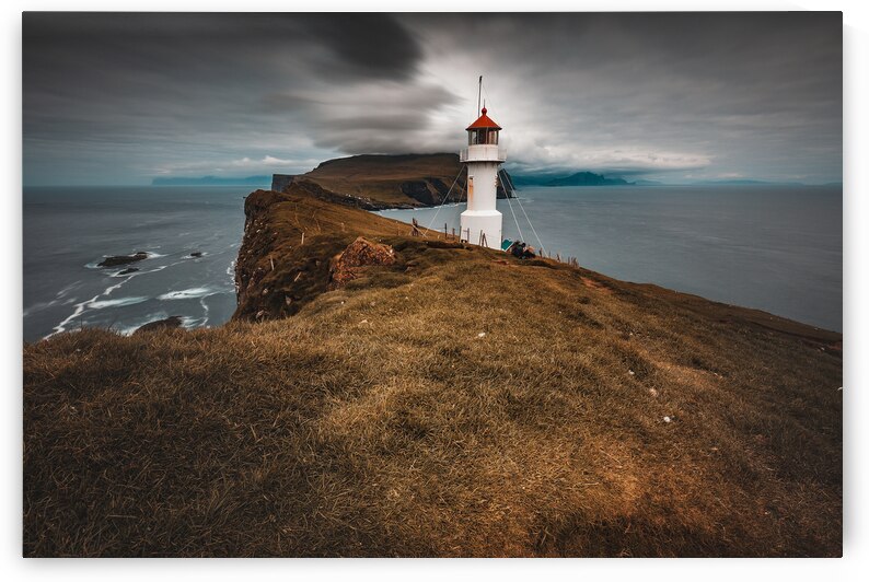 lighthouse on the island of Mykines Faroe. by Gualtiero Boffi