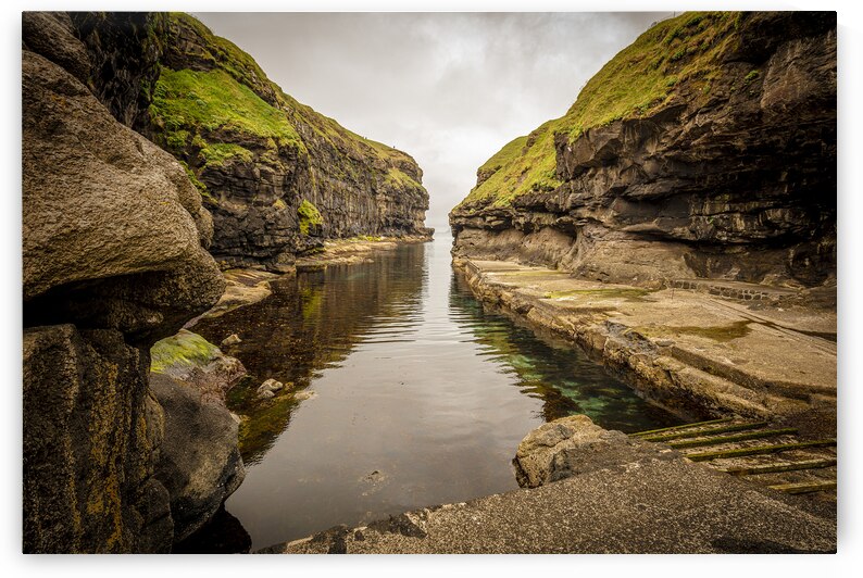 view of the famous port among the cliffs of Gjogv on the Faroe I by Gualtiero Boffi