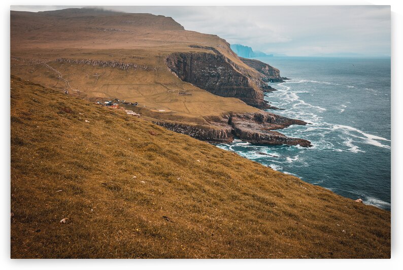  cliffs and the village on the island of Mykines Faroe. by Gualtiero Boffi