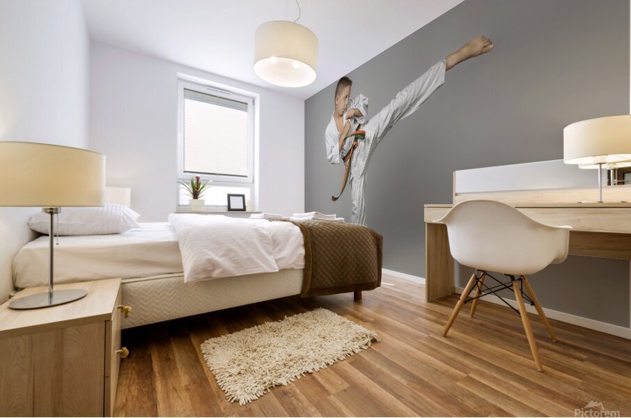 boy performs a side kick Mural print