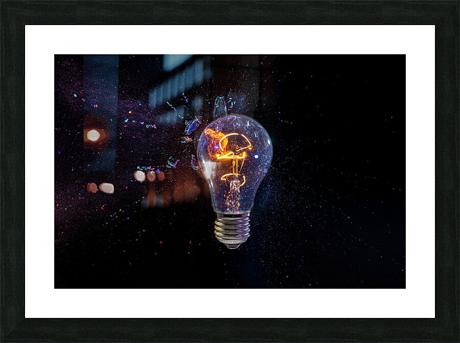 old bulb breaking into fragments on black  Picture Frame print