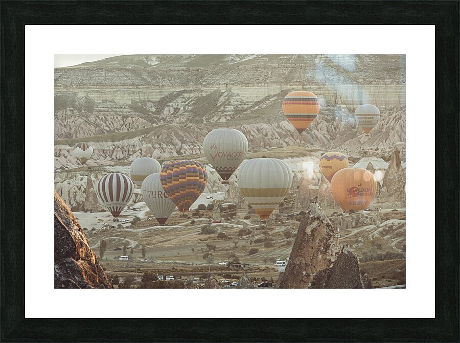  hot air balloons fly over the city of goreme at sunrise Picture Frame print