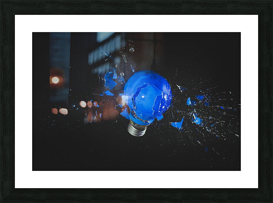 blue light bulb exploding on black.  Picture Frame print